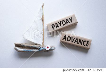 Payday Advance symbol. Concept word Payday Advance on wooden blocks. Beautiful white background with boat. Business and Payday Advance concept. Copy space 121603593