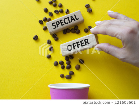 Special offer symbol. Concept word Special offer on wooden blocks. Businessman hand. Beautiful yellow background with coffee cup. Business and Special offer concept. Copy space Special offer symbol. Concept word Special offer on wooden blocks. Businessman hand. Beautiful yellow background with coffee cup. Business and Special offer concept. Copy space 121603601
