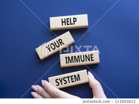 Immune System symbol. Wooden blocks with words Help Your Immune System. Beautiful deep blue background. Doctor hand. Medicine and Help Your Immune System concept. Copy space. 121603622