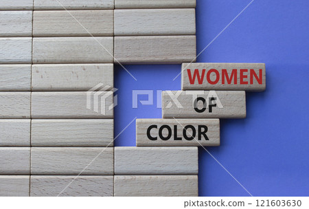 Women of color symbol. Concept words Women of color on wooden blocks. Beautiful purple background. Business and Women of color concept. Copy space. Women of color symbol. Concept words Women of color on wooden blocks. Beautiful purple background. Business and Women of color concept. Copy space. 121603630
