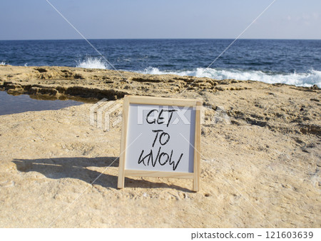 Get to Know symbol. White Blackboard with words Get to Know. Beautiful sea background. Business and Get to Know concept. Copy space. Get to Know symbol. White Blackboard with words Get to Know. Beautiful sea background. Business and Get to Know concept. Copy space. 121603639