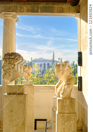 Busts in the Stoa of Attalos building and Temple of Hephaestous in the background at the Ancient Agora in Athens, Greece 121603824