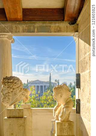 Busts in the Stoa of Attalos building and Temple of Hephaestous in the background at the Ancient Agora in Athens, Greece 121603825