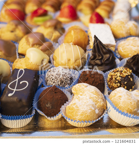 Typical Italian pastries mix in a tray close-up Typical Italian pastries mix in a tray close-up 121604831