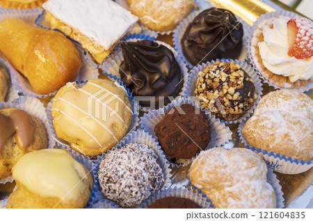 Traditional Italian pastries mix in a tray close-up 121604835