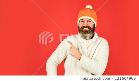 Look at this. mature man posing with funny outfit. man beard in winter hat. portrait of trendy guy wearing hat. Male winter style. Modern winter knitted hat. Funky happy bearded man. copy space 121604969