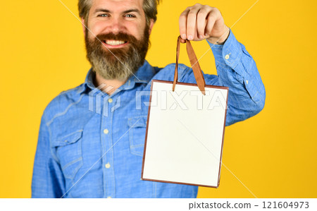 Retail concept. Hipster buying sale price. Cyber monday sale. Nice purchase. Bearded man hold shopping bags. Handsome buyer. Seasonal sale. Special offer. Happy birthday. Buy gift. Black Friday Retail concept. Hipster buying sale price. Cyber monday sale. Nice purchase. Bearded man hold shopping bags. Handsome buyer. Seasonal sale. Special offer. Happy birthday. Buy gift. Black Friday 121604973