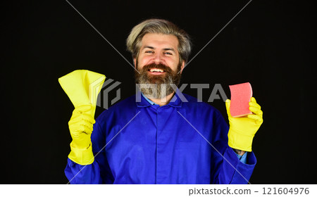 A lot of work. Housekeeping concept. Duty and cleaner. male using sponge. Take care hygiene. bearded man in yellow rubber gloves wiping dust using duster. cleaning at home 121604976