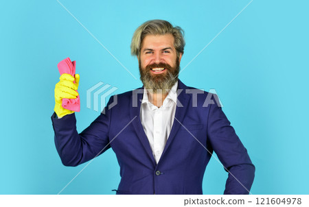 handsome businessman with washing gloves. use sponge and detergent for floor cleaning. clear business. housekeeping and cleaning concept. House cleaning. bearded man doing housework and cleaning handsome businessman with washing gloves. use sponge and detergent for floor cleaning. clear business. housekeeping and cleaning concept. House cleaning. bearded man doing housework and cleaning 121604978
