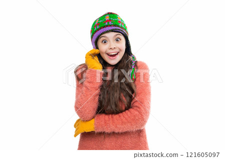 Portrait of teen child wearing warm winter clothes. Girl kid wear warm hat isolated on white. Happy childhood. Teen girl in earflap hat. Winter fashion style. Girl in knitwear. Hat and gloves set 121605097