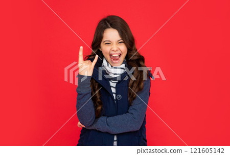 portrait of child wearing warm clothes. express positive emotion. winter fashion. 121605142