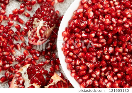 Ripe red pomegranate seeds close-up 121605180