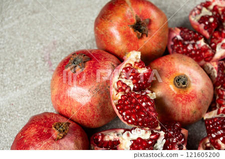 Ripe pomegranates, peeled and whole, the concept of benefits and vitamins in fruit. Ripe pomegranates, peeled and whole, the concept of benefits and vitamins in fruit. 121605200