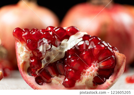 Close-up of pomegranate seeds, an open fruit, the benefits of pomegranates. Close-up of pomegranate seeds, an open fruit, the benefits of pomegranates. 121605205