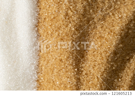 Two types of crystalline sugar are white refined beet sugar and brown unrefined cane sugar. Two types of crystalline sugar are white refined beet sugar and brown unrefined cane sugar. 121605213