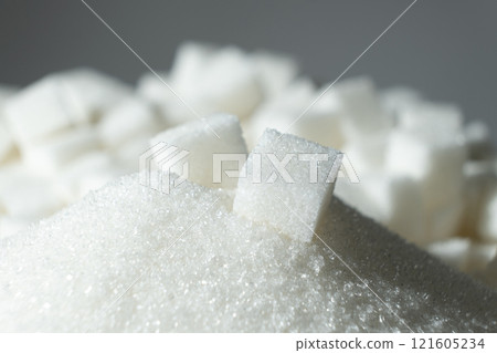 White refined beet sugar in the form of crystals and cubes. 121605234