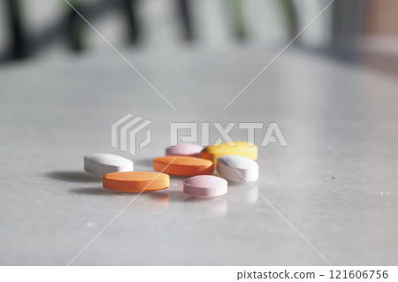 An Array of Assorted Vitamins and Medications on table  121606756