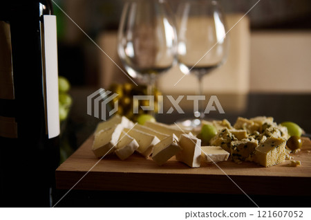 Wine Bottle with Cheese Platter on Wooden Board 121607052