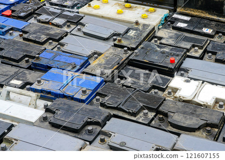 Stack of many used car batteries for recycling in a hazardous waste facility Stack of many used car batteries for recycling in a hazardous waste facility 121607155