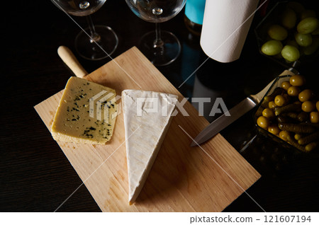 Cheese Board with Wine and Appetizers on Wooden Table Cheese Board with Wine and Appetizers on Wooden Table 121607194