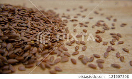 Macro Shot of Flaxseeds, Linseeds on a Rustic Wooden Surface 121607208