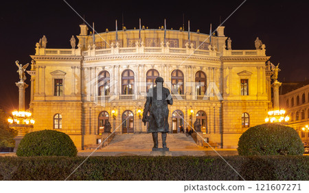 Building of Rudolfinum with statue of composer Antonin Dvorak from back. Night shot. Famous concert hall and home of the Czech Philharmonic, Prague, Czech Republic. Building of Rudolfinum with statue of composer Antonin Dvorak from back. Night shot. Famous concert hall and home of the Czech Philharmonic, Prague, Czech Republic. 121607271