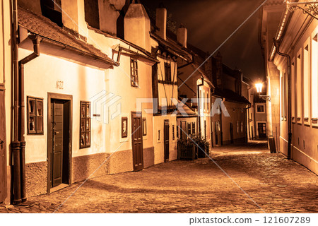 Small medieval houses in Golden Lane by night, Prague Castle, Czech Republic. Small medieval houses in Golden Lane by night, Prague Castle, Czech Republic. 121607289