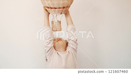 A little girl plays with a generic toy hot air balloon. Freedom or imagination concepts 121607460