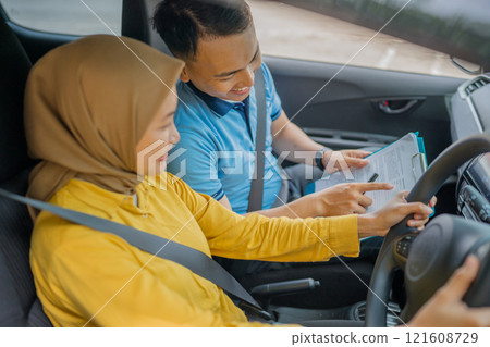 Driving Lesson Qualified Instructor Effectively Guides Student During Car Session Driving Lesson Qualified Instructor Effectively Guides Student During Car Session 121608729