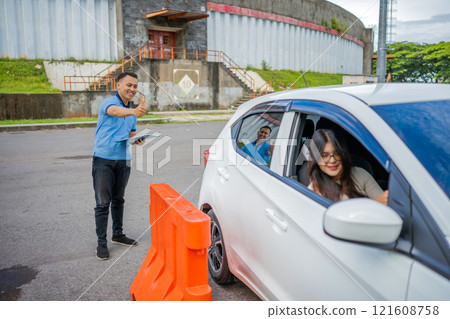 Enjoyable and Friendly Interaction at the DriveThrough Checkpoint Area Enjoyable and Friendly Interaction at the DriveThrough Checkpoint Area 121608758