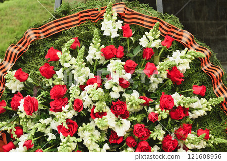Basket with red rose and lily Saint George ribbon 121608956
