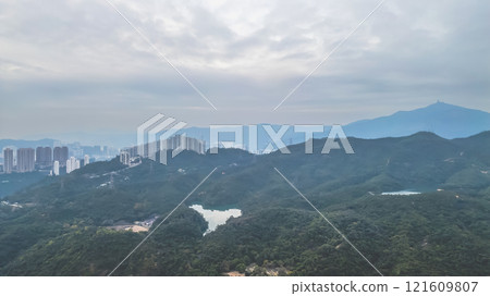 View of Lush Forested Mountains and Serene Reservoir Dec 24 2024 121609807