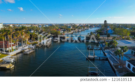 Coastal Waterfront Homes in Florida with Yachts and Palm Trees 121610513