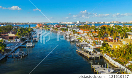 Coastal Waterfront Homes in Florida with Yachts and Palm Trees 121610537