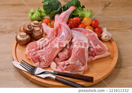 Note: This is raw, uncooked meat. Christmas roast chicken, chicken thighs and thighs on the bone for roast legs 121611332