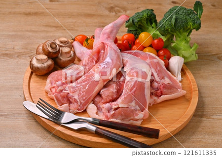 Note: This is raw, uncooked meat. Christmas roast chicken, chicken thighs and thighs on the bone for roast legs Note: This is raw, uncooked meat. Christmas roast chicken, chicken thighs and thighs on the bone for roast legs 121611335