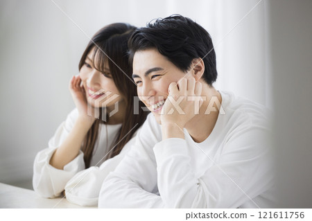 Men and women laughing looking up 121611756