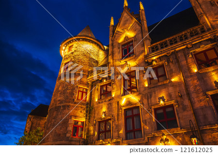 walls of old medieval castle illuminated at night in French village in Ba Na Hills Park in Da Nang in Vietnam 121612025