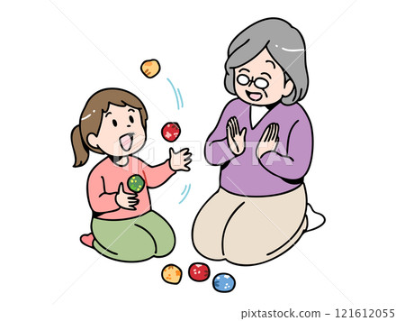 A child being taught how to juggle by his grandmother 121612055