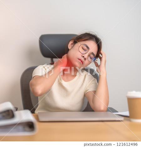 Woman having Neck and Shoulder pain during work long time on workplace. due to fibromyalgia, rheumatism, Scapular pain, office syndrome and ergonomic concept 121612496