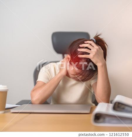 Woman having headache, stress and Migraine during work long time on workplace, stressed Asian Woman using laptop, Tired female businesswoman working overload Woman having headache, stress and Migraine during work long time on workplace, stressed Asian Woman using laptop, Tired female businesswoman working overload 121612550