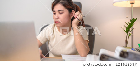 stressed Asian Woman using laptop, Tired female businesswoman working overload with headache and Sleepy at office, Exhausted casual woman with computer at late night in home. Work Life Balance concept 121612587