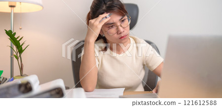 stressed Asian Woman using laptop, Tired female businesswoman working overload with headache and Sleepy at office, Exhausted casual woman with computer at late night in home. Work Life Balance concept 121612588