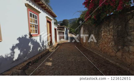 Charming Colonial Street with Stone-paved Road in Summer Charming Colonial Street with Stone-paved Road in Summer 121612651