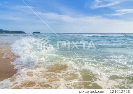 White waves crashing on the sandy beach and emerald green sea / Phuket, Thailand White waves crashing on the sandy beach and emerald green sea / Phuket, Thailand 121612798