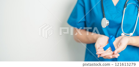 March Colorectal Cancer Awareness month, doctor with dark Blue Ribbon for supporting people living and illness. Healthcare, hope and World cancer day concept 121613279