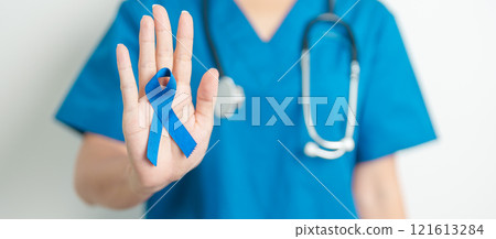 March Colorectal Cancer Awareness month, doctor with dark Blue Ribbon for supporting people living and illness. Healthcare, hope and World cancer day concept 121613284