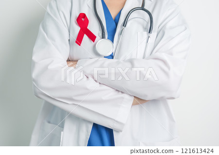 Doctor with Red Ribbon for December World Aids Day, acquired immune deficiency syndrome, multiple myeloma Cancer Awareness month and National Red ribbon week. Healthcare and world cancer day concept 121613424