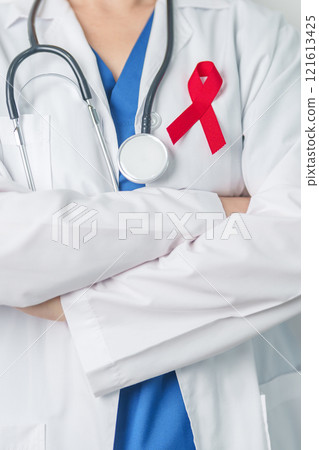 Doctor with Red Ribbon for December World Aids Day, acquired immune deficiency syndrome, multiple myeloma Cancer Awareness month and National Red ribbon week. Healthcare and world cancer day concept 121613425