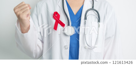 Doctor with Red Ribbon for December World Aids Day, acquired immune deficiency syndrome, multiple myeloma Cancer Awareness month and National Red ribbon week. Healthcare and world cancer day concept 121613426